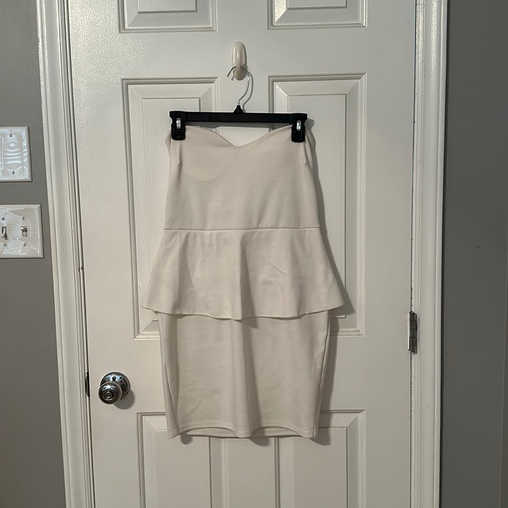 White peplum body con dress
